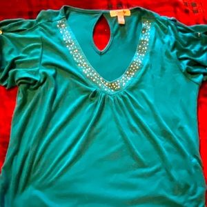 Super cute teal top with emblems